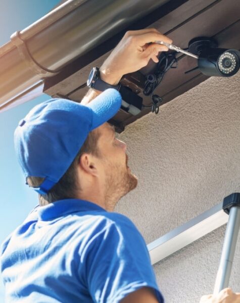 man install outdoor surveillance ip camera for home security